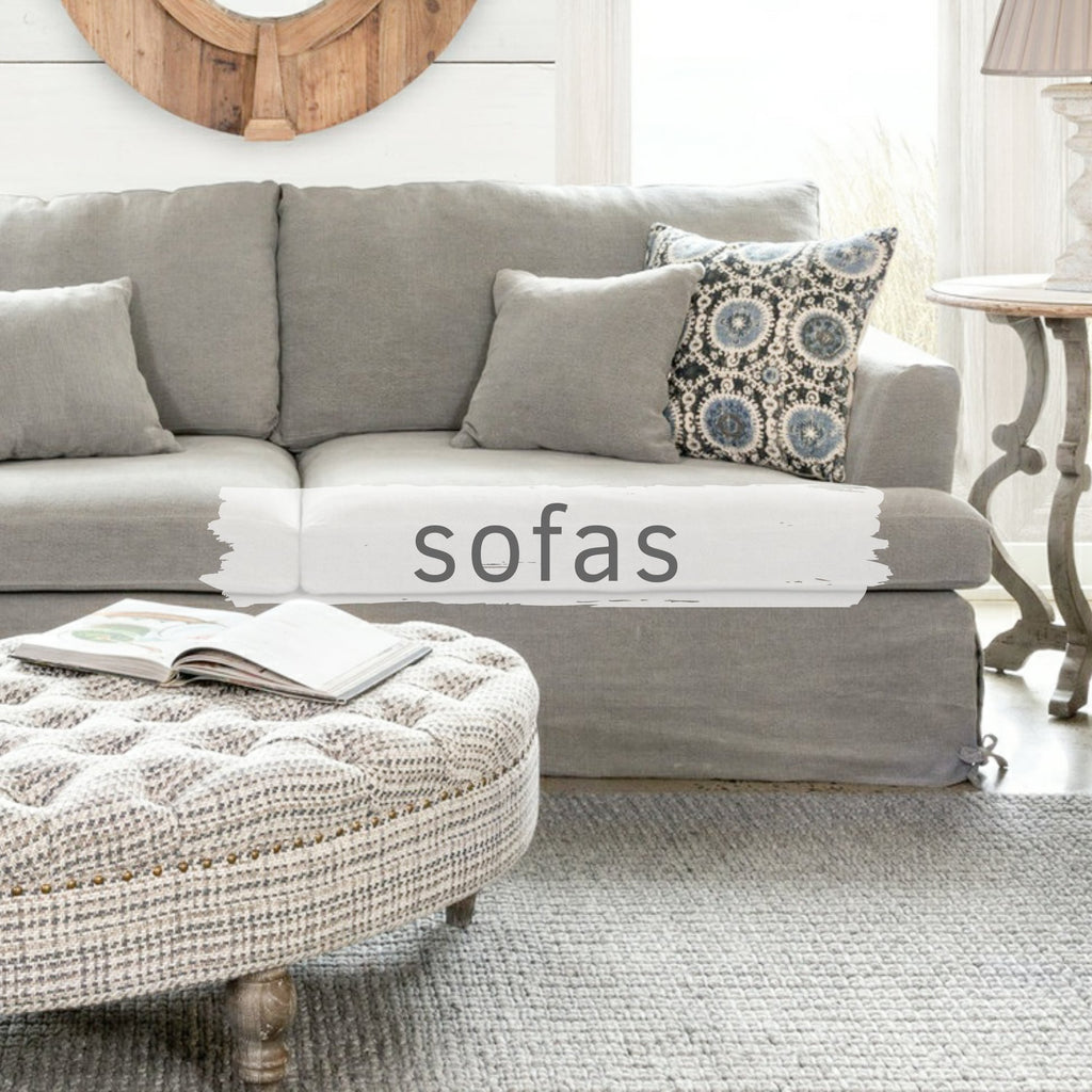 Sturdy, comfortable looking sofa with a grayish blue slip cover