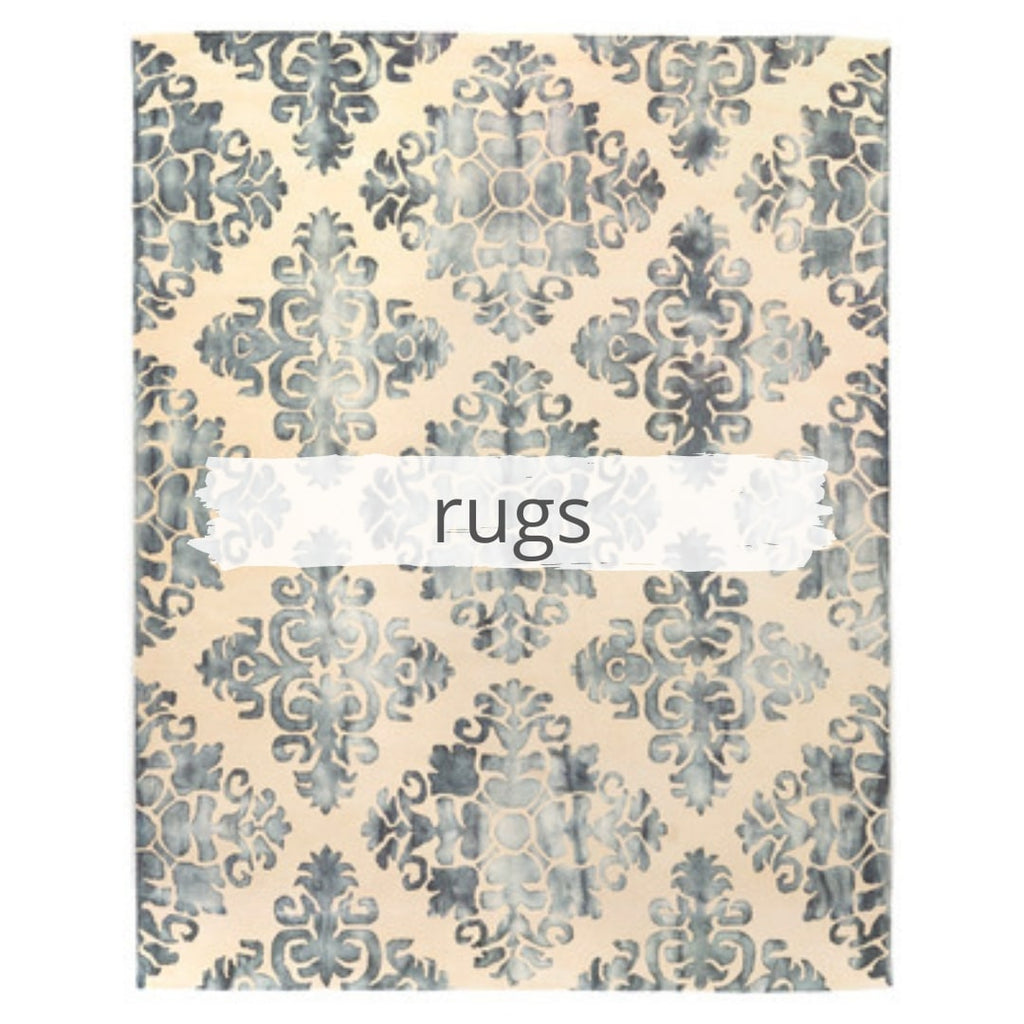 Cream and blue rug with faded motif