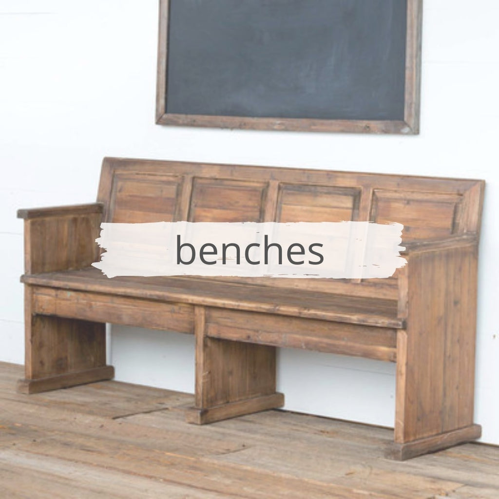 Chapel bench, rustic one and chalkboard hanging behind. 