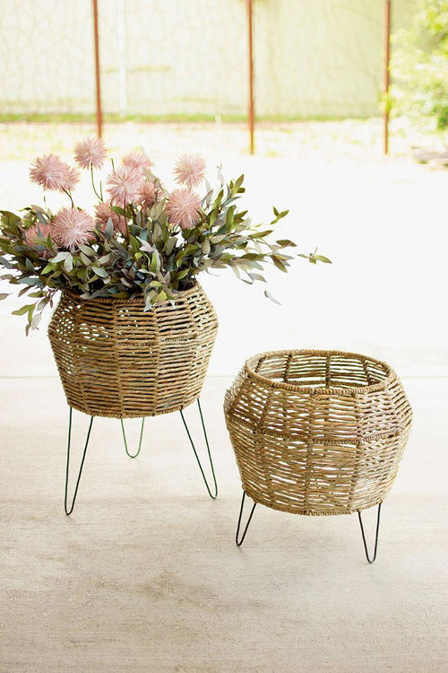 SET OF TWO ROUND SEAGRASS PLANTERES ON IRON STANDS