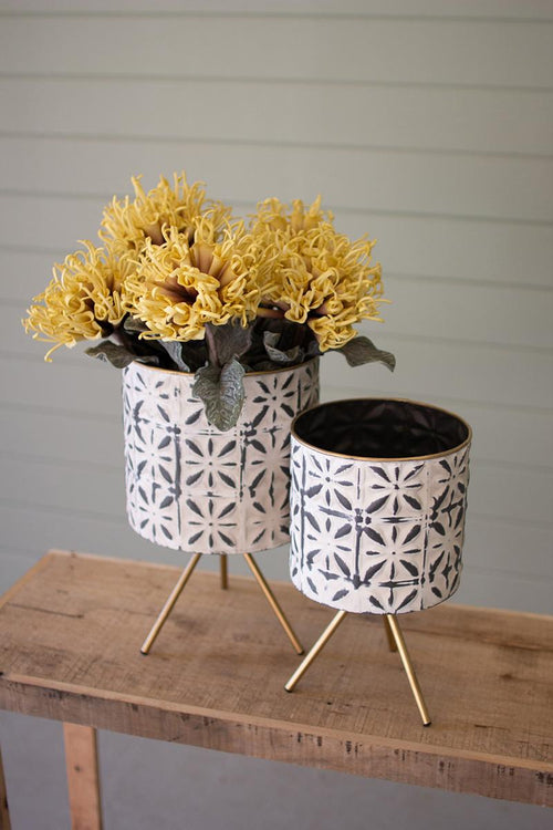SET OF TWO ROUND PRESSED METAL PLANTERS ON STANDS