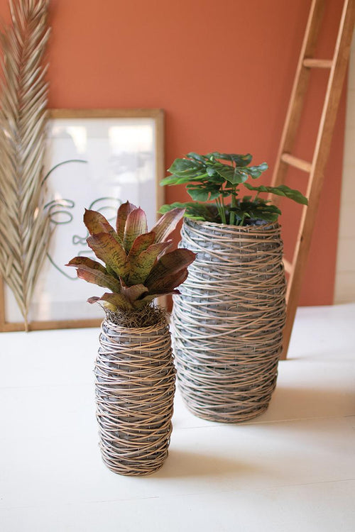 SET OF TWO TALL OVAL RATTAN PLANTERS
