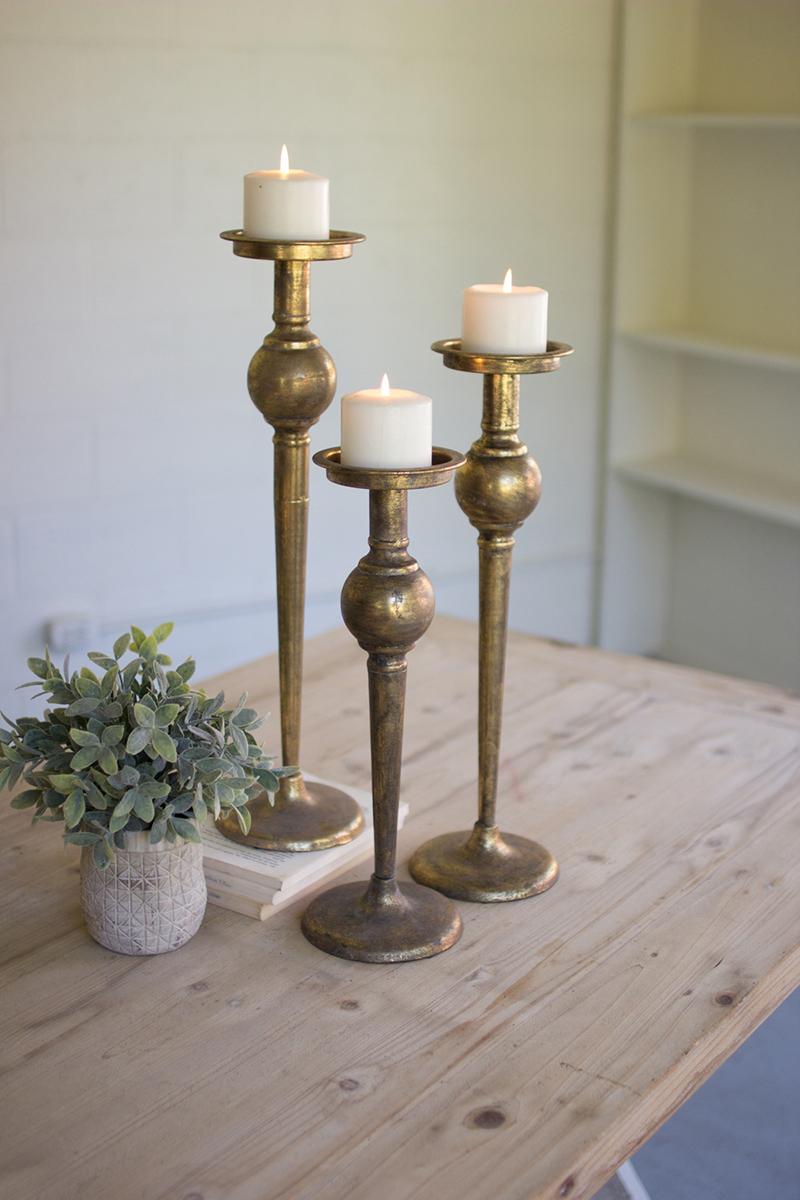SET OF THREE METAL CANDLE STANDS