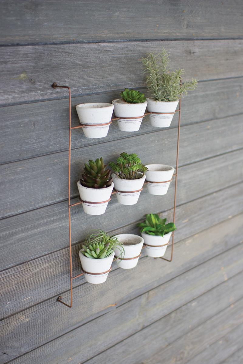 SET OF NINE WHITE WASH CLAY POTS ON COPPER FINISH WALL RACK