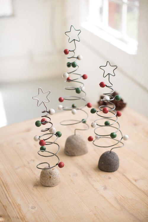 SET OF THREE WIRE CHRISTMAS TREE TOPIARIES ON ROCK BASES