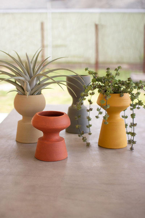 SET OF FOUR CLAY VASES - ONE EACH COLOR