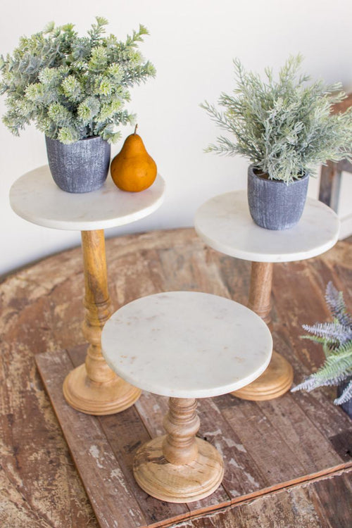 SET OF THREE WOODEN DISPLAY STANDS WITH WHITE MARBLE TOPS
