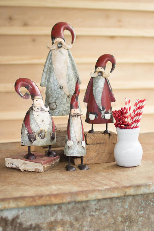 SET OF FOUR GALVANIZED AND PAINTED SANTAS